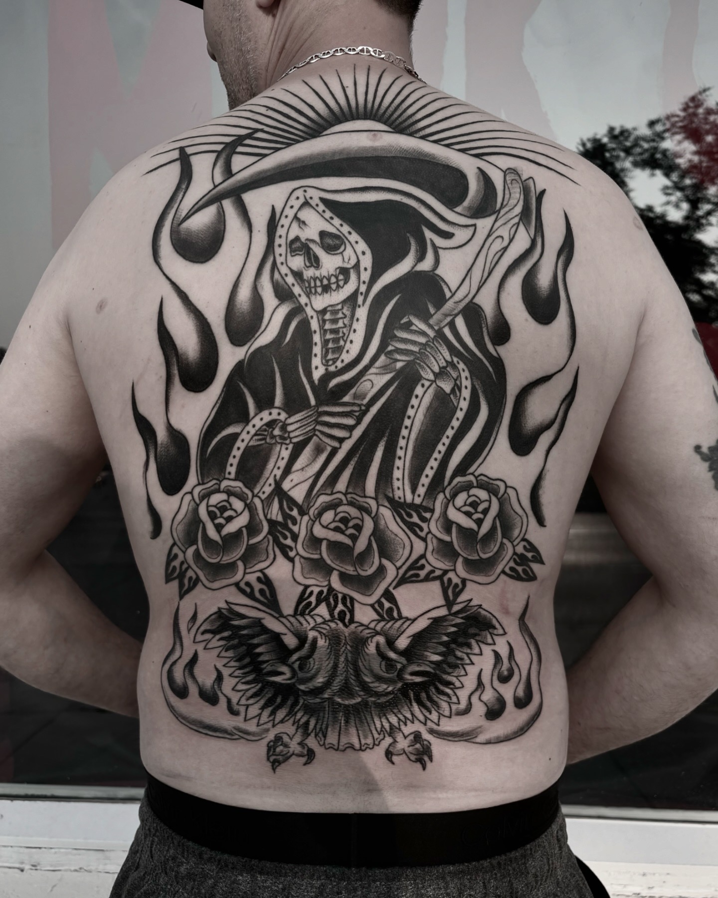 Large scale grim reaper and roses back tattoo